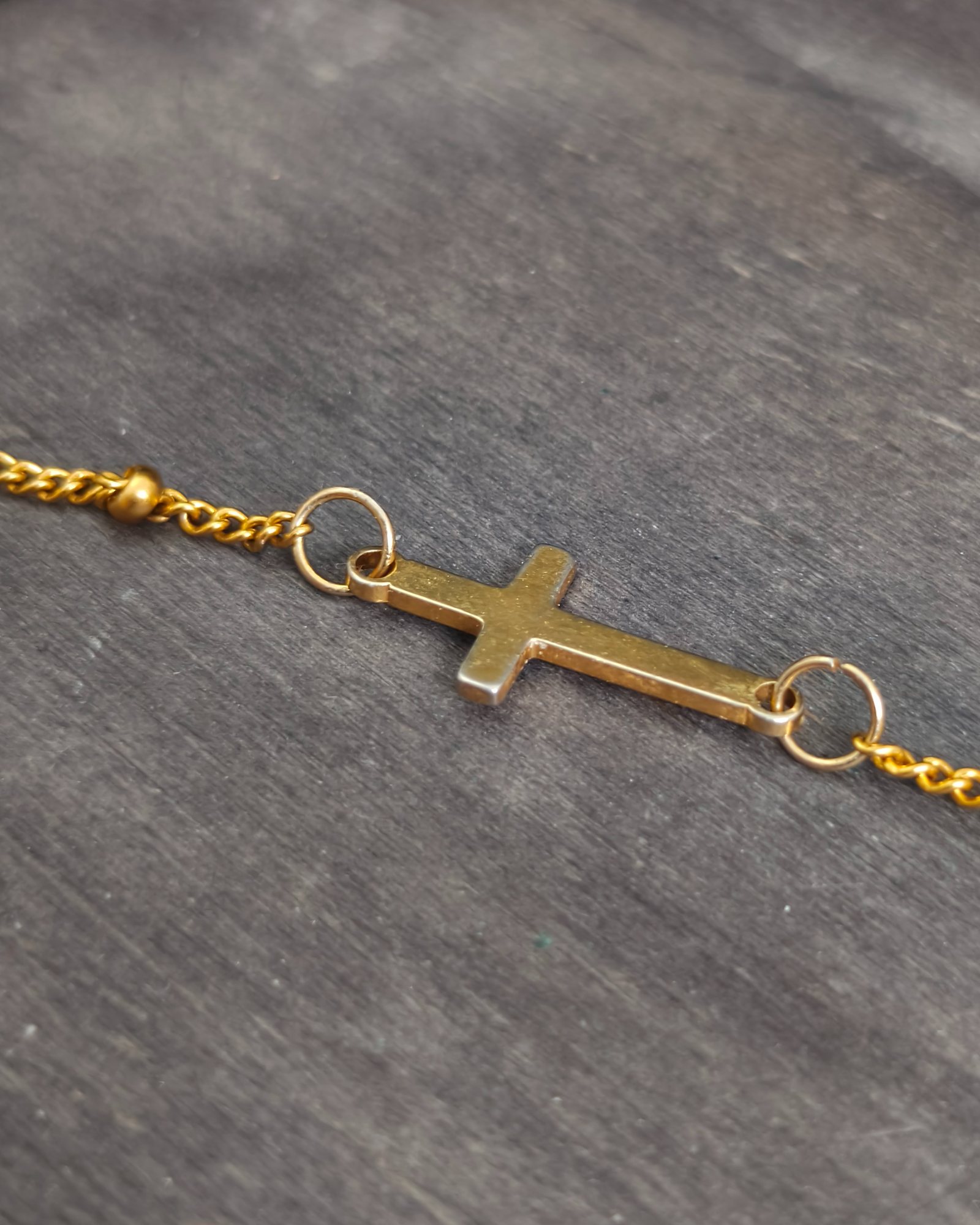 Delicate bracelet with a stainless steel cross (alternate view)