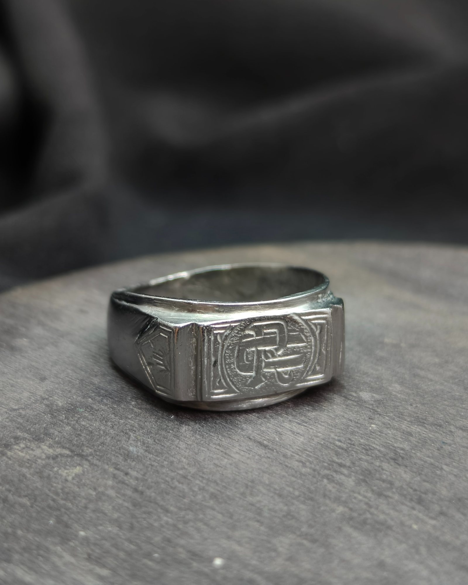 Stamp with initials "R" and "U"