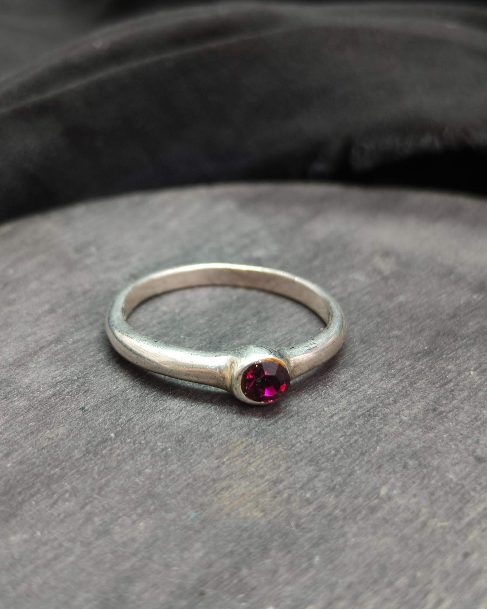 Silver plated ring with purple diamond