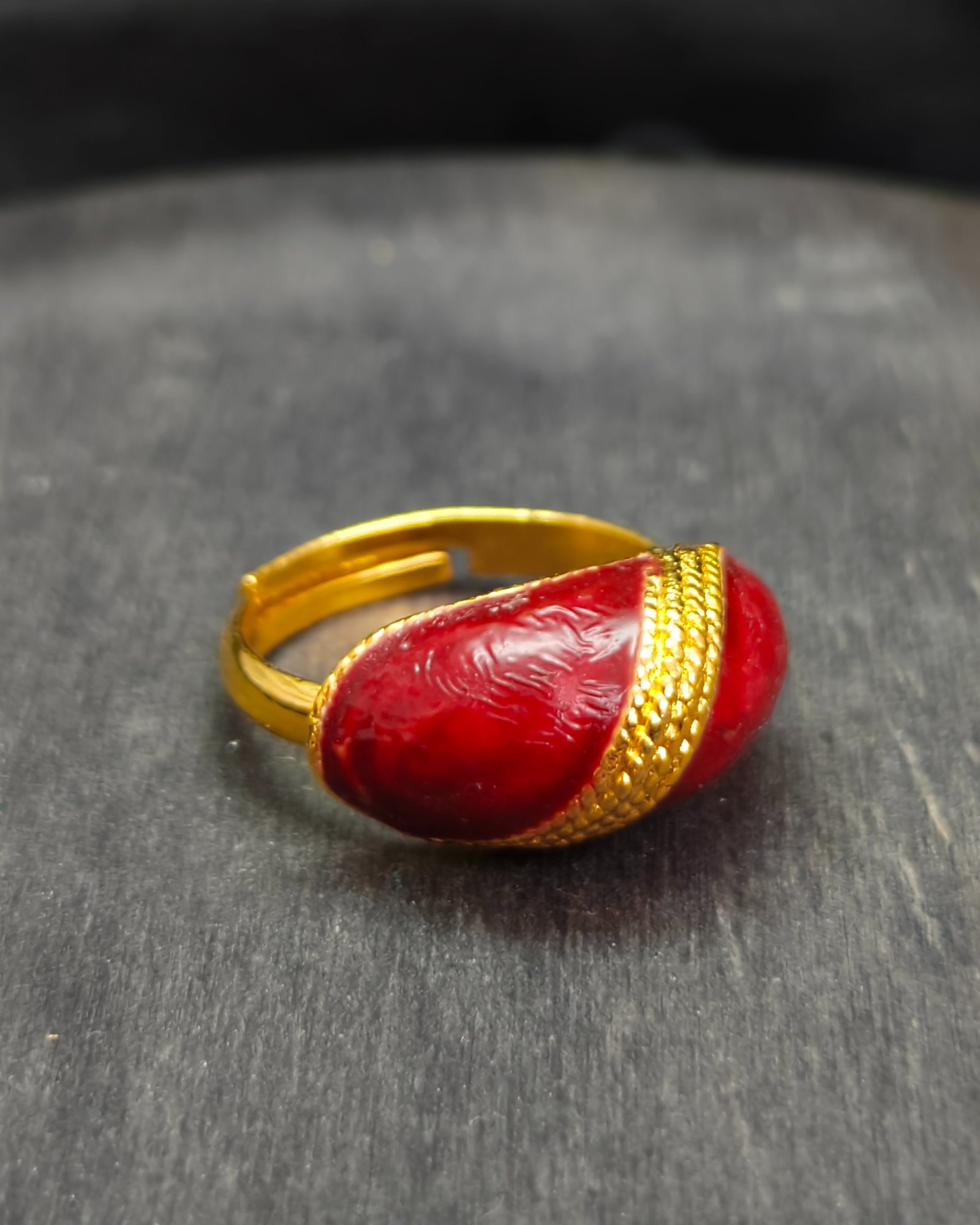 Gold-tone adjustable ring with red resin