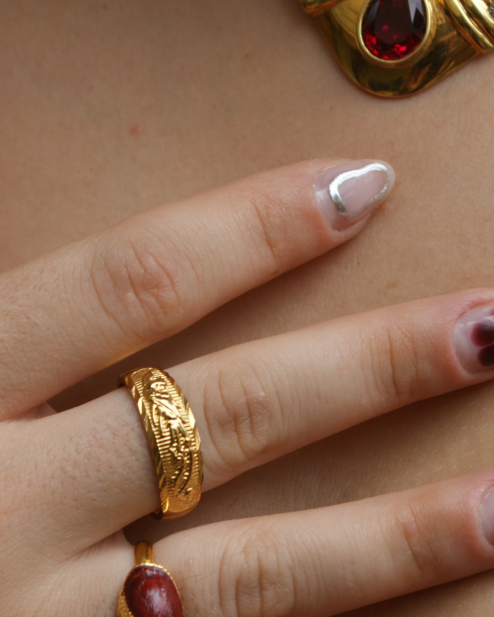 Adjustable ring with a Phoenix in relief (alternate view)
